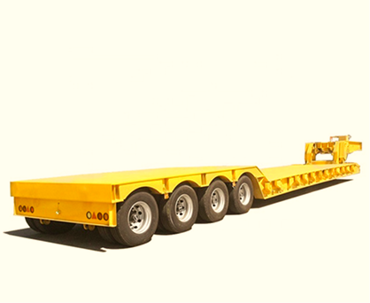 Yellow heavy-duty flatbed trailer with four tires on one side for transporting large equipment.